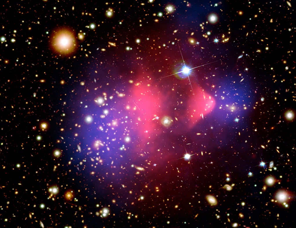 Two different hazy areas overlay a wide field of galaxies