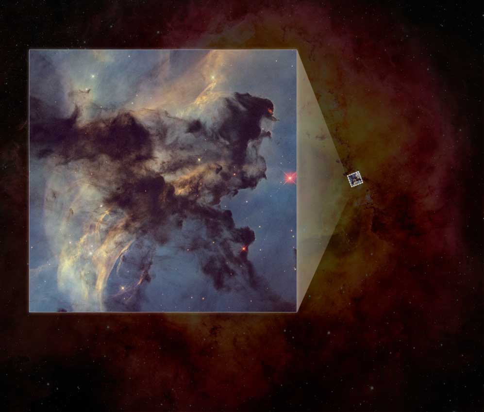 Dark clouds surround a gas-filled area. Few stars visible